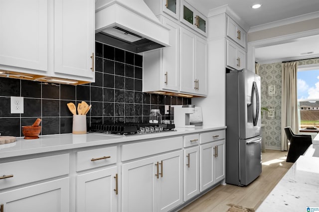 0222 Blackridge Cir, Hoover, AL 35244 - kitchen featuring appliances with stainless steel finishes, custom range hood, light countertops, light wood finished floors, and white cabinets