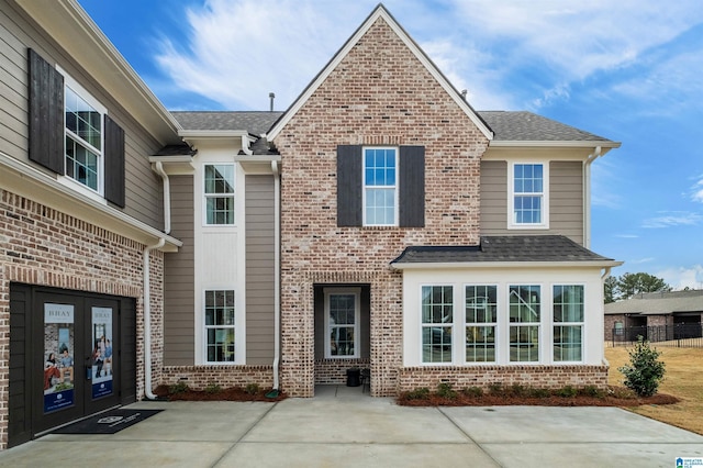 0222 Blackridge Cir, Hoover, AL 35244 - view of front facade with french doors, brick siding, and a shingled roof