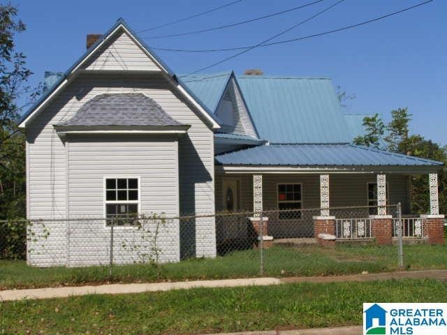 114 E Coffee St, Talladega, AL 35160 - view of front of property featuring covered porch and a metal roof