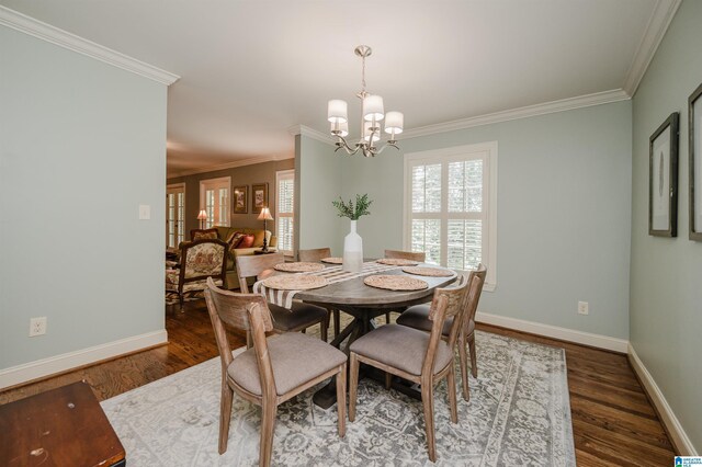 3764 Valley Head Rd, Mountain Brook, AL 35223 - dining room featuring ornamental molding, wood finished floors, a chandelier, and healthy amount of natural light