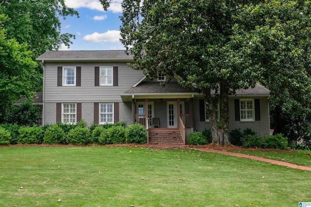 3764 Valley Head Rd, Mountain Brook, AL 35223 - view of front of house featuring a front yard, brick siding, and covered porch