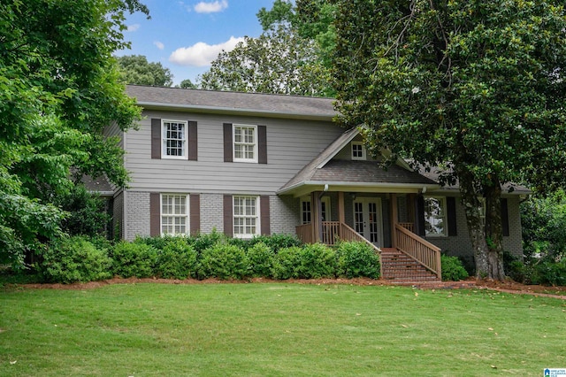 3764 Valley Head Rd, Mountain Brook, AL 35223 - view of front of property with a front yard, brick siding, covered porch, and french doors