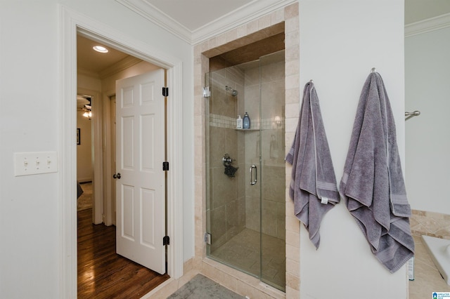 3764 Valley Head Rd, Mountain Brook, AL 35223 - full bathroom featuring a stall shower, ornamental molding, wood finished floors, and a bathtub