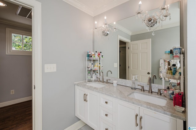 3764 Valley Head Rd, Mountain Brook, AL 35223 - bathroom featuring double vanity, a chandelier, ornamental molding, and wood finished floors