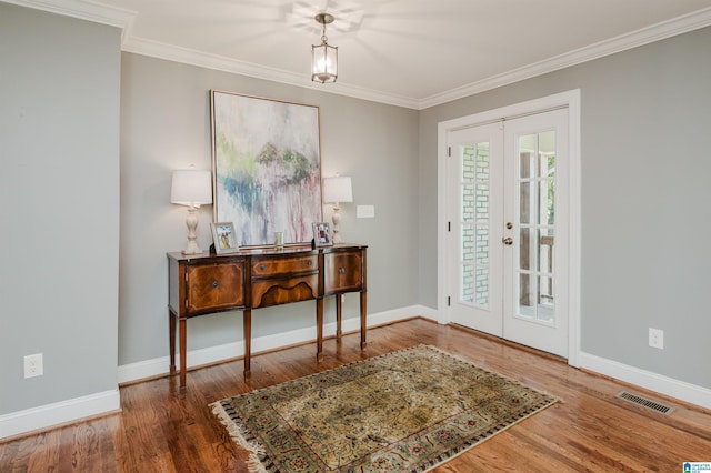 3764 Valley Head Rd, Mountain Brook, AL 35223 - foyer with french doors, wood finished floors, and crown molding