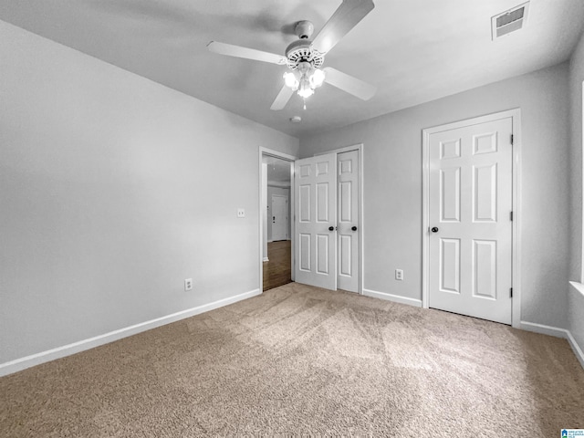 118 S Hill Dr, Wilsonville, AL 35186 - unfurnished bedroom featuring carpet flooring, ceiling fan, and a closet