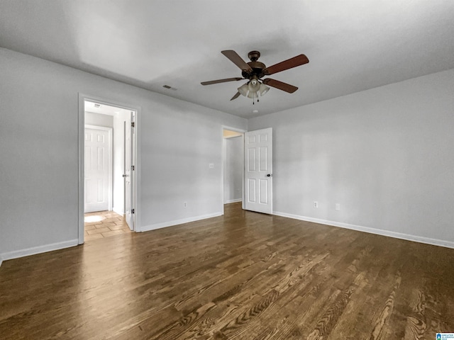 118 S Hill Dr, Wilsonville, AL 35186 - unfurnished room featuring ceiling fan and dark wood-type flooring