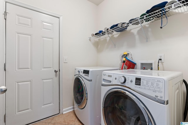 394 Glen Cross Way, Trussville, AL 35173 - laundry room featuring washer and dryer and light tile patterned floors