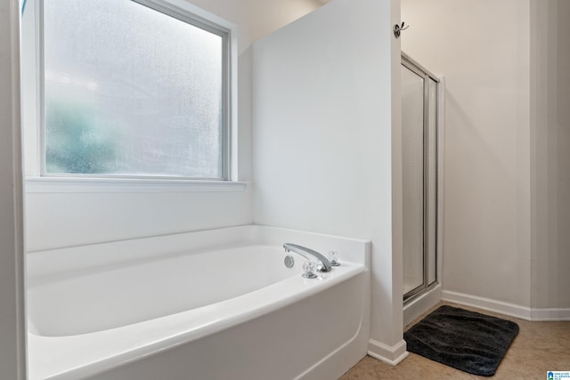 394 Glen Cross Way, Trussville, AL 35173 - full bathroom featuring healthy amount of natural light, a garden tub, a stall shower, and tile patterned floors