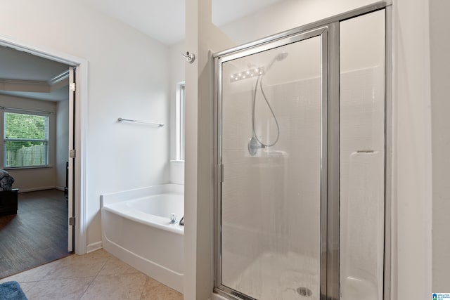 394 Glen Cross Way, Trussville, AL 35173 - bathroom featuring a garden tub, a shower stall, and tile patterned flooring