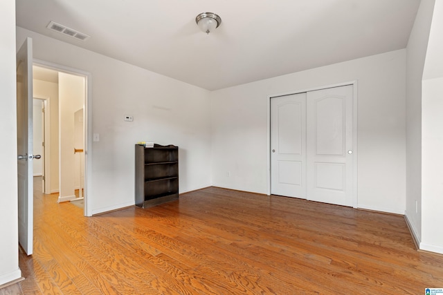 394 Glen Cross Way, Trussville, AL 35173 - unfurnished bedroom with light wood finished floors and a closet