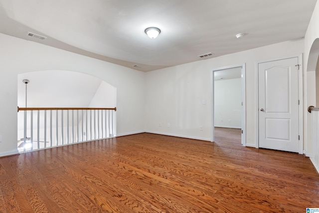 394 Glen Cross Way, Trussville, AL 35173 - empty room featuring wood finished floors, a smoke detector, and arched walkways