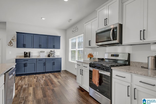 181 Halifax Ln, Chelsea, AL 35043 - kitchen featuring stainless steel appliances, dark wood-style flooring, recessed lighting, light stone counters, and blue cabinets