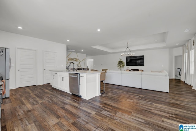 181 Halifax Ln, Chelsea, AL 35043 - kitchen with appliances with stainless steel finishes, open floor plan, a raised ceiling, dark wood finished floors, and recessed lighting