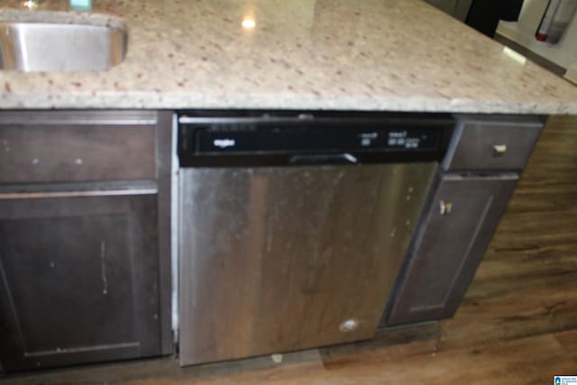 6284 Fieldbrook Cir, Mccalla, AL 35111 - kitchen with stainless steel dishwasher, light stone countertops, wood finished floors, and dark brown cabinets