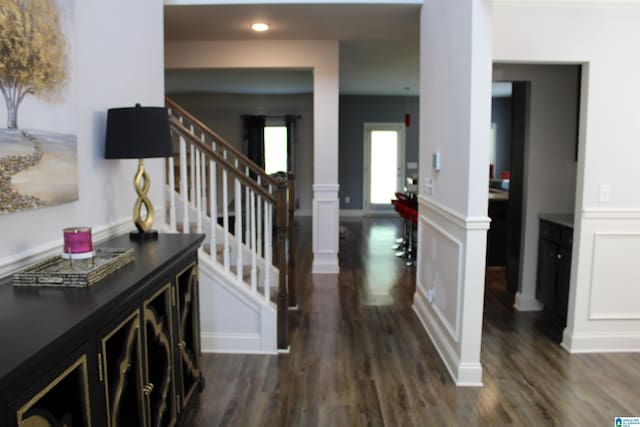 6284 Fieldbrook Cir, Mccalla, AL 35111 - foyer entrance featuring ornate columns, dark wood finished floors, stairway, a wainscoted wall, and recessed lighting