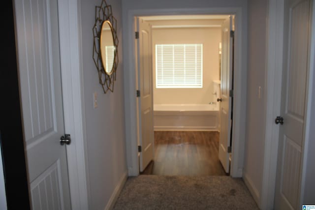 6284 Fieldbrook Cir, Mccalla, AL 35111 - hallway with baseboards and wood finished floors