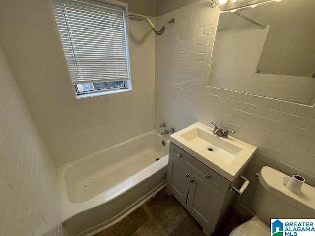 204 Gary Ave, Talladega, AL 35160 - bathroom featuring tile walls, tub / shower combination, and vanity
