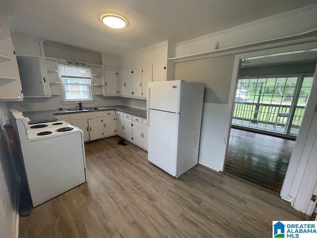 204 Gary Ave, Talladega, AL 35160 - kitchen featuring white appliances, open shelves, wood finished floors, and white cabinets
