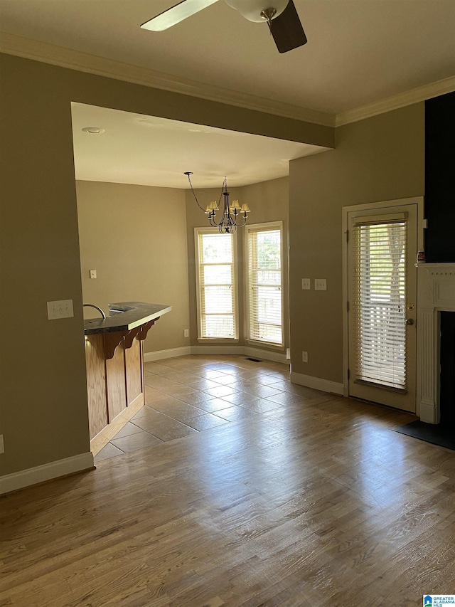 22917 Country Ridge Parkway, Mccalla, AL 35111 - unfurnished dining area featuring plenty of natural light, ornamental molding, a chandelier, a ceiling fan, and wood finished floors