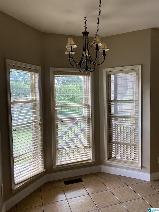22917 Country Ridge Parkway, Mccalla, AL 35111 - unfurnished dining area featuring a chandelier and light tile patterned flooring