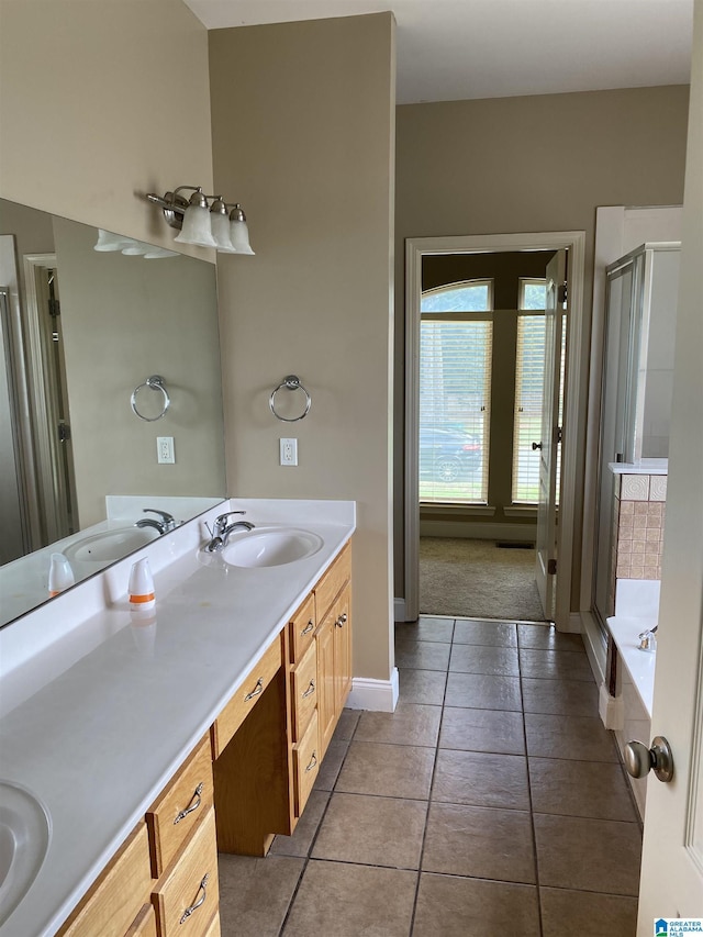 22917 Country Ridge Parkway, Mccalla, AL 35111 - full bathroom with double vanity, a shower stall, tile patterned floors, and a bath
