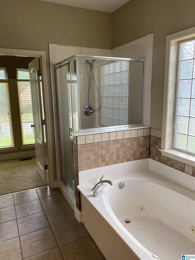 22917 Country Ridge Parkway, Mccalla, AL 35111 - full bathroom featuring a whirlpool tub, a shower stall, and tile patterned flooring