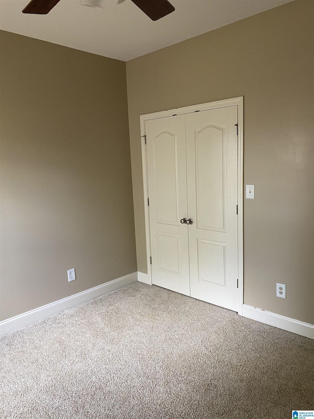 22917 Country Ridge Parkway, Mccalla, AL 35111 - unfurnished bedroom with carpet, a closet, and a ceiling fan