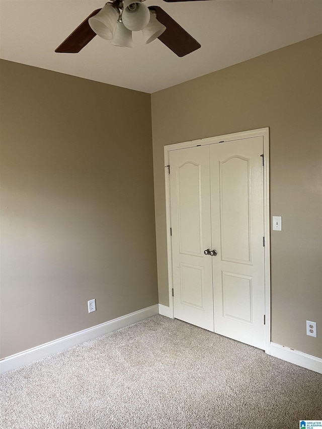 22917 Country Ridge Parkway, Mccalla, AL 35111 - unfurnished bedroom with carpet floors, a closet, and a ceiling fan