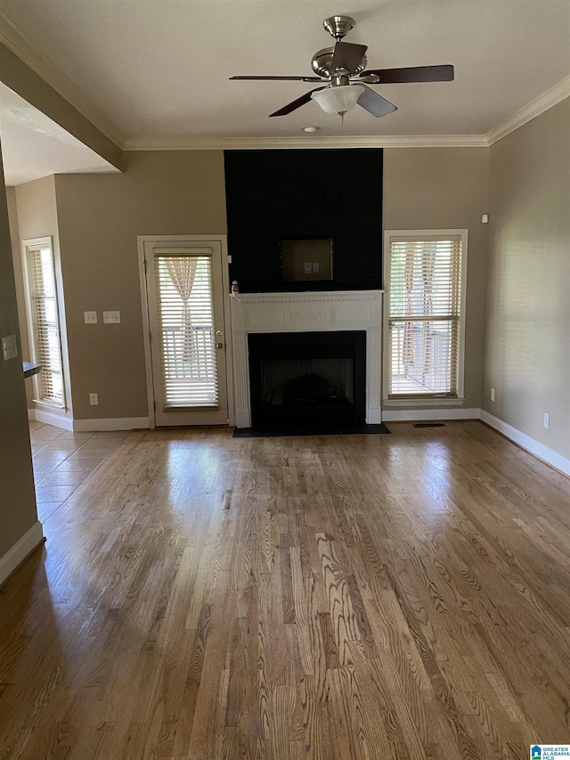 22917 Country Ridge Parkway, Mccalla, AL 35111 - unfurnished living room with crown molding, ceiling fan, wood finished floors, and a fireplace with flush hearth