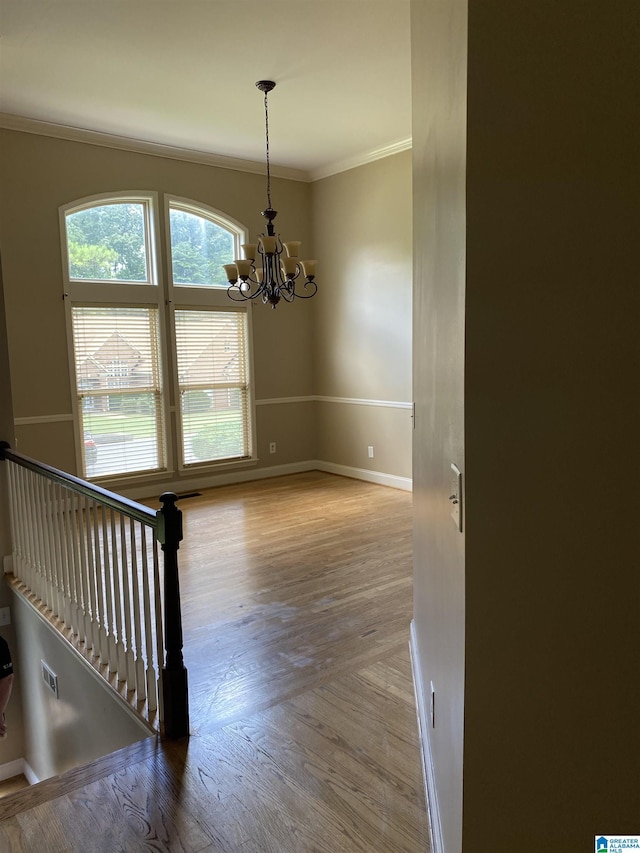 22917 Country Ridge Parkway, Mccalla, AL 35111 - unfurnished room featuring a chandelier, ornamental molding, and wood finished floors