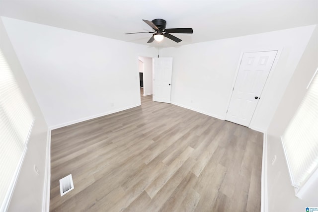 805 Jacksonville St, Weaver, AL 36277 - unfurnished bedroom featuring wood finished floors and ceiling fan