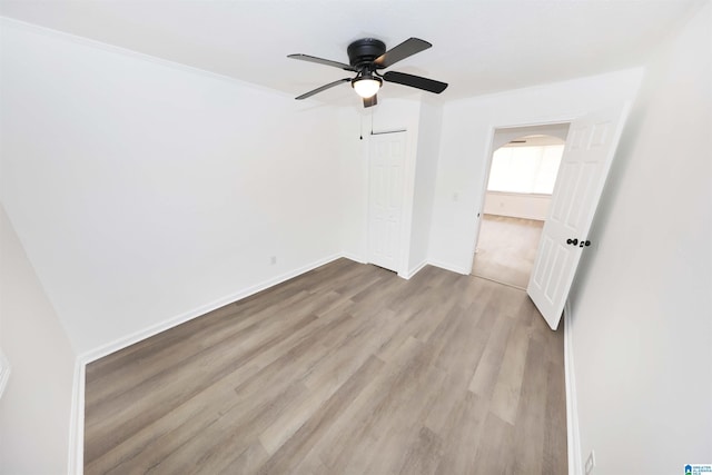 805 Jacksonville St, Weaver, AL 36277 - unfurnished room featuring wood finished floors, ceiling fan, and arched walkways