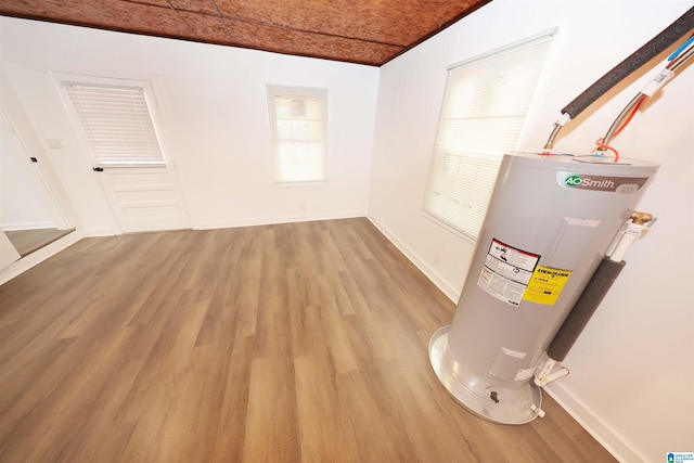 805 Jacksonville St, Weaver, AL 36277 - utility room featuring electric water heater