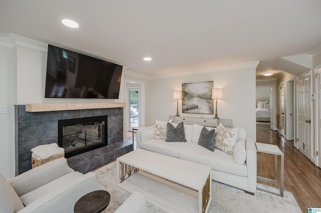 110 Pine Cliff Cir, Hoover, AL 35226 - living room with ornamental molding, wood finished floors, a tiled fireplace, and recessed lighting