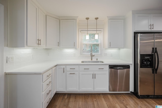 110 Pine Cliff Cir, Hoover, AL 35226 - kitchen with appliances with stainless steel finishes, light countertops, white cabinets, and backsplash