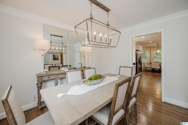 110 Pine Cliff Cir, Hoover, AL 35226 - dining area featuring a chandelier, ornamental molding, and dark wood-type flooring
