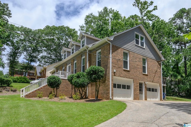 110 Pine Cliff Cir, Hoover, AL 35226 - view of home's exterior featuring asphalt driveway, an attached garage, brick siding, a yard, and stairway