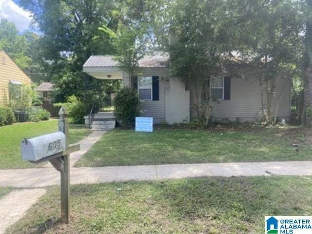605 39th Pl, Fairfield, AL 35064 - obstructed view of property featuring a front lawn