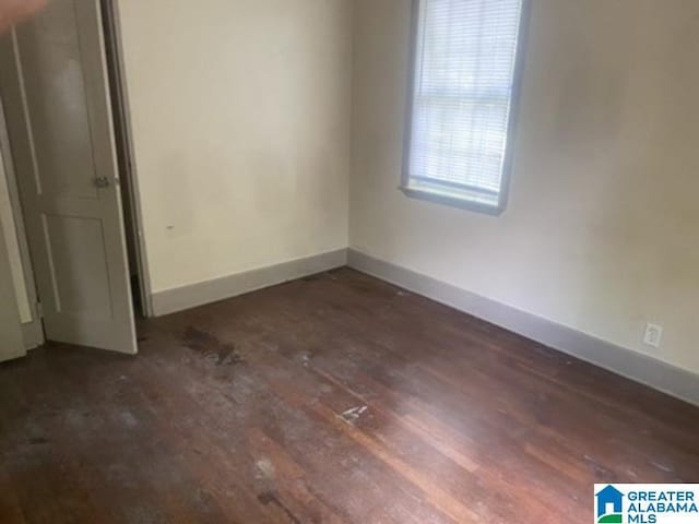 605 39th Pl, Fairfield, AL 35064 - empty room featuring dark wood finished floors