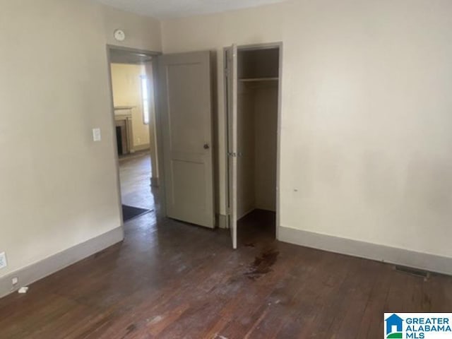 605 39th Pl, Fairfield, AL 35064 - unfurnished bedroom with dark wood-style floors and a closet