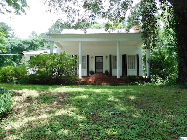 16145 US Highway 11, Springville, AL 35146 - view of front of house featuring a porch, a chimney, and a front yard