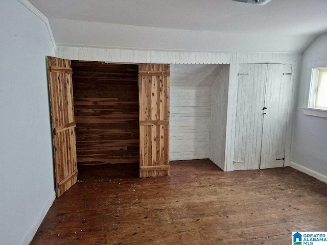 16145 US Highway 11, Springville, AL 35146 - unfurnished bedroom with hardwood / wood-style flooring and vaulted ceiling