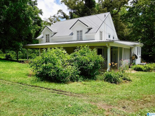 16145 US Highway 11, Springville, AL 35146 - view of front facade featuring a front lawn, a metal roof, and a porch