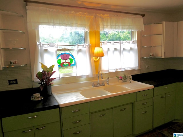 16145 US Highway 11, Springville, AL 35146 - kitchen featuring green cabinetry, backsplash, and light countertops