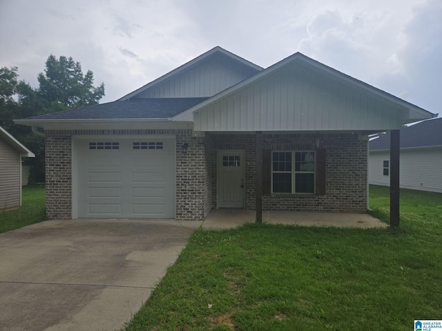 107 Steppville Garden Dr, Hanceville, AL 35077 - view of front of home featuring brick siding, driveway, a garage, and a front lawn