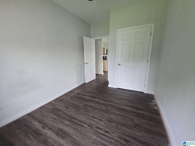 107 Steppville Garden Dr, Hanceville, AL 35077 - unfurnished bedroom with dark wood-type flooring and baseboards