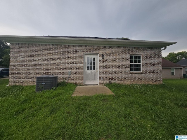 107 Steppville Garden Dr, Hanceville, AL 35077 - back of house featuring brick siding and a yard
