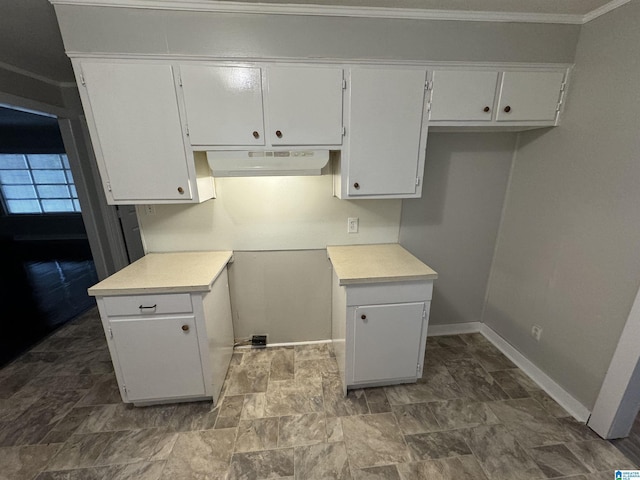 5295 Snowville Brent Rd, Dora, AL 35062 - kitchen featuring under cabinet range hood, white cabinets, light countertops, and ornamental molding