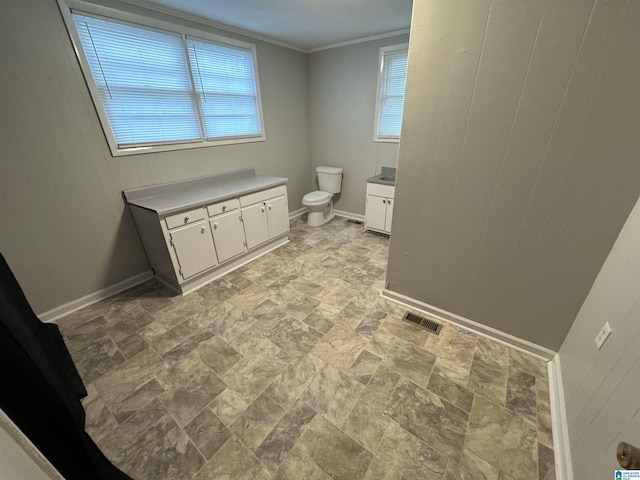 5295 Snowville Brent Rd, Dora, AL 35062 - bathroom featuring vanity, stone finish flooring, crown molding, and wood walls